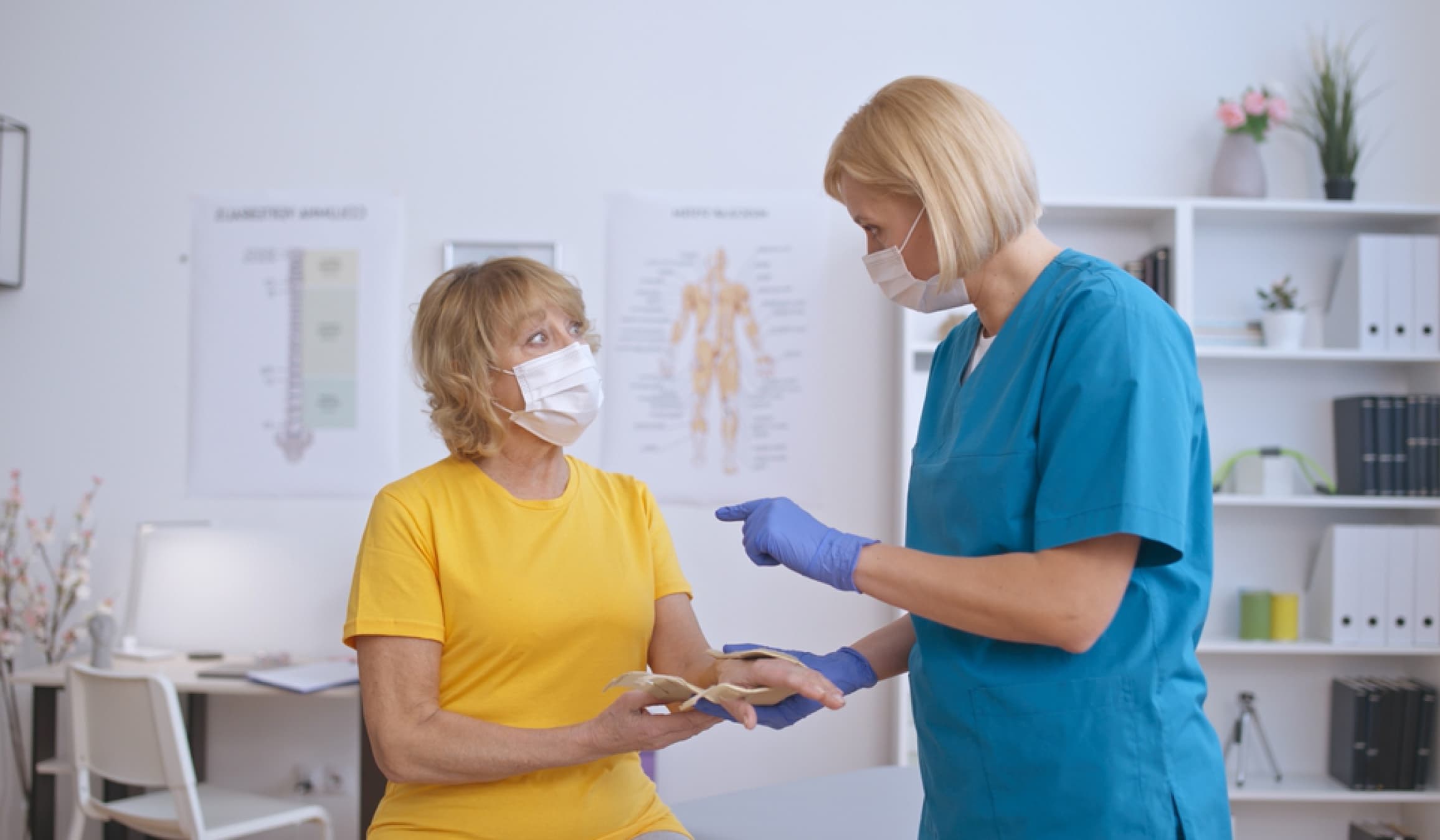 Podiatrist talking with a patient in the clinic