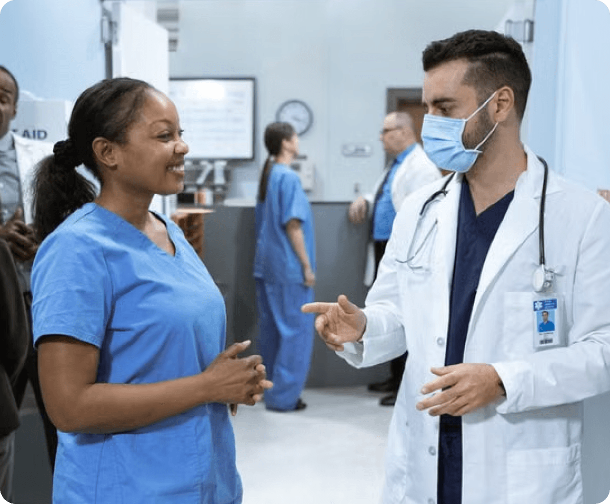 Podiatrist talking with a colleague in a busy clinic